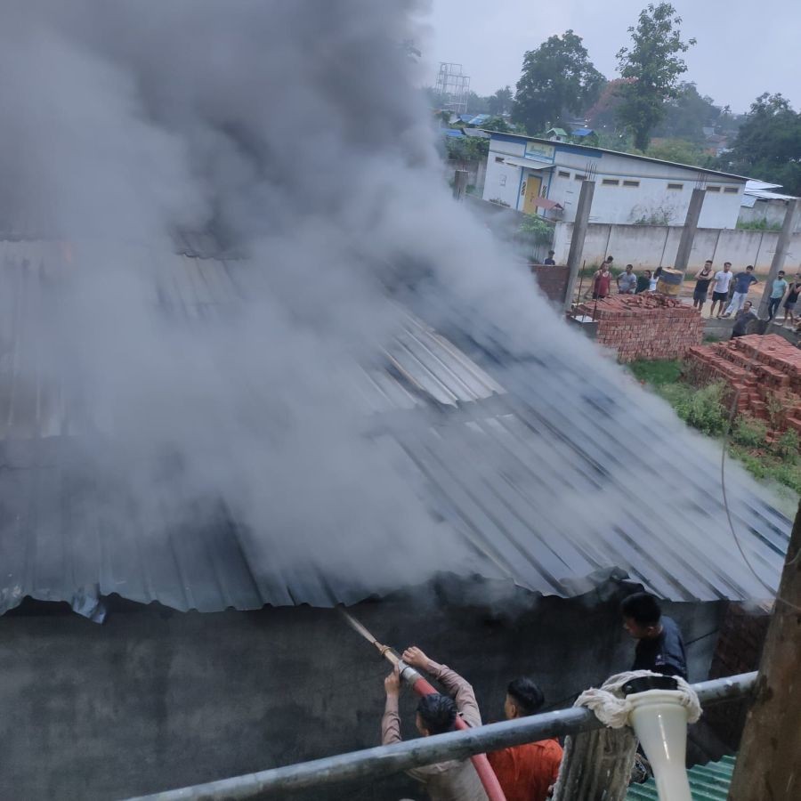 Fire-fighters struggling to douse the fire which broke out at a godown at Lakeview colony, Dimapur on June 10.